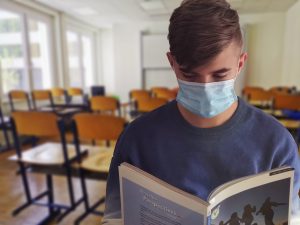 child wearing mask in classroom
